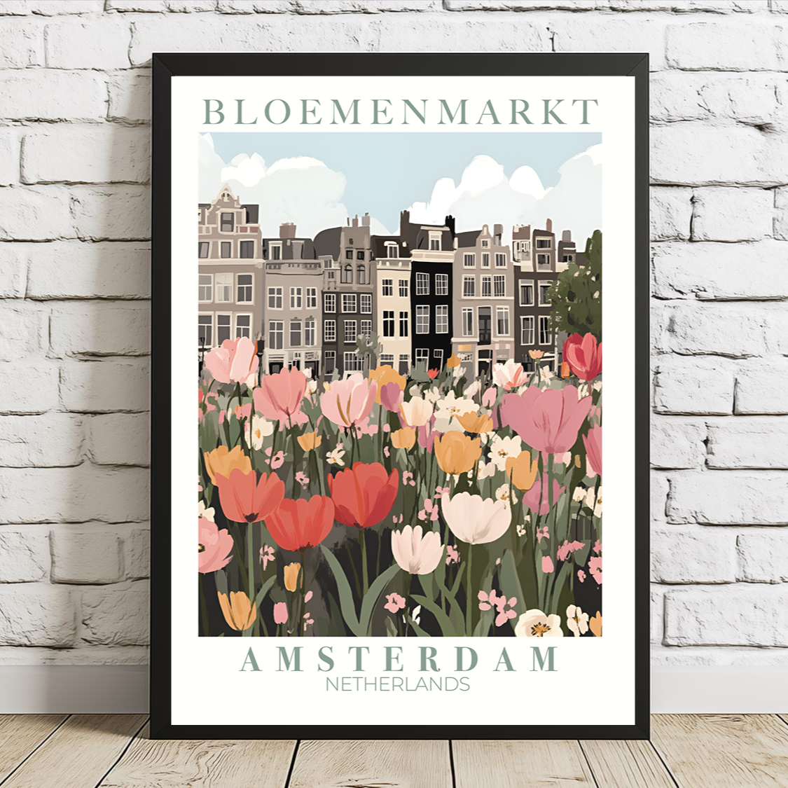 Framed poster of Amsterdam with tulips and buildings on a white brick wall.