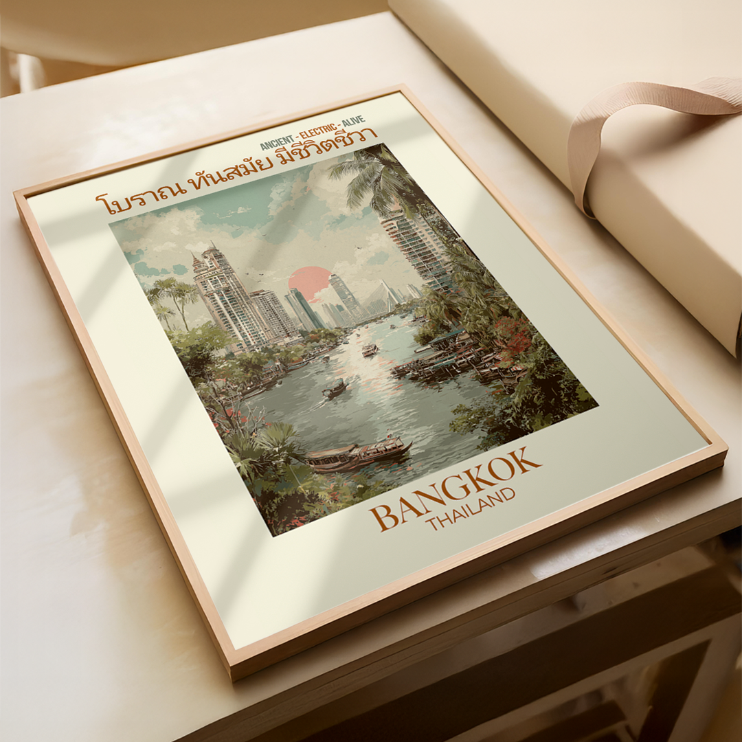 Framed artwork of Bangkok, Thailand on a light wooden surface