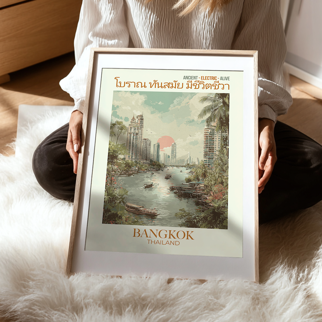 Person holding a framed poster of Bangkok, Thailand