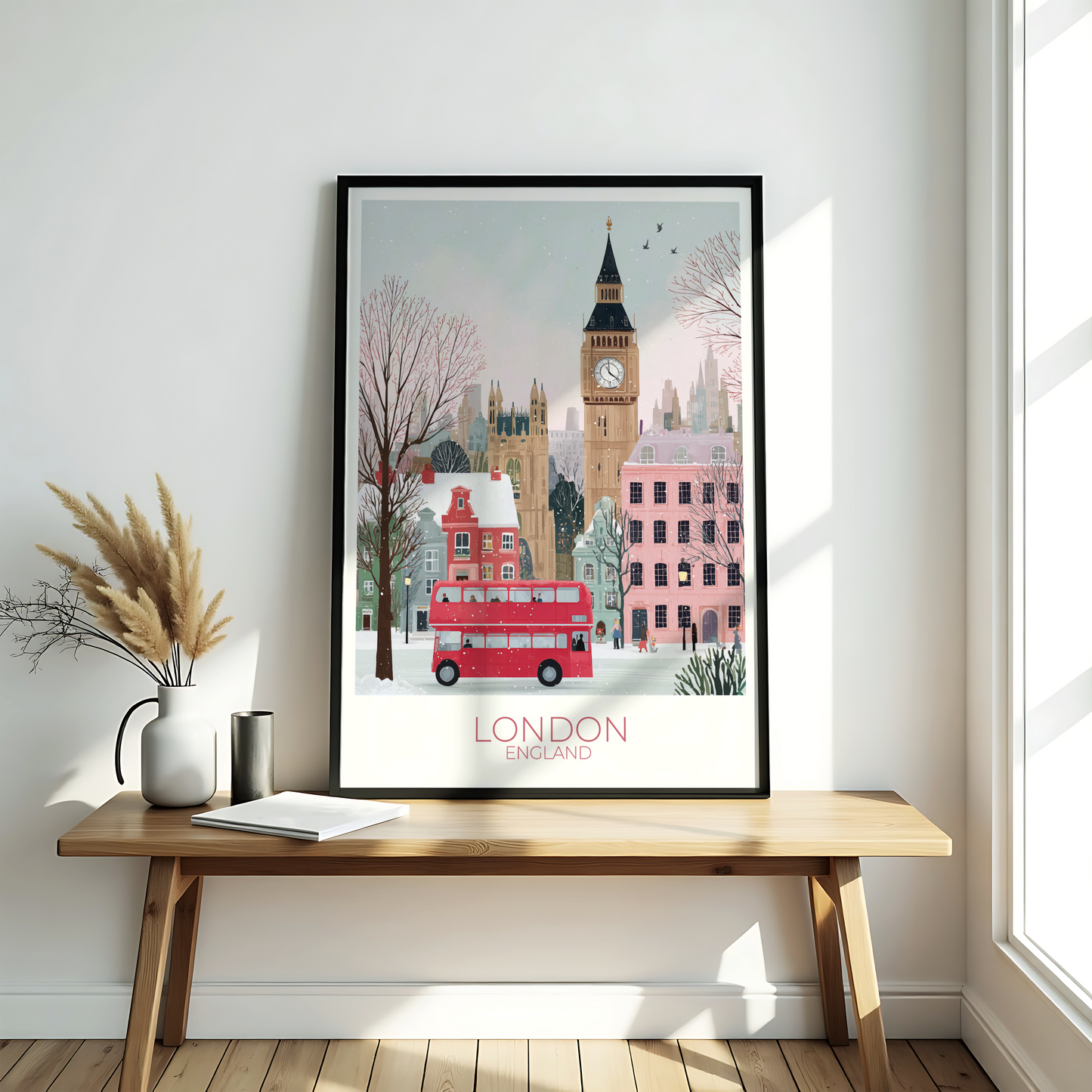 Framed artwork of London with a red double-decker bus and Big Ben on a wooden bench.