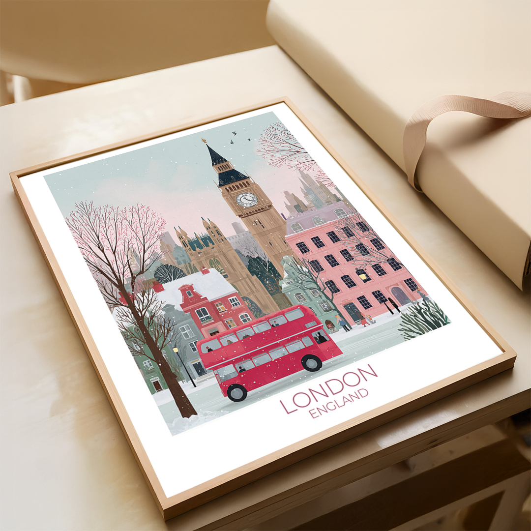 Framed artwork of London with Big Ben and a red double-decker bus on a table.