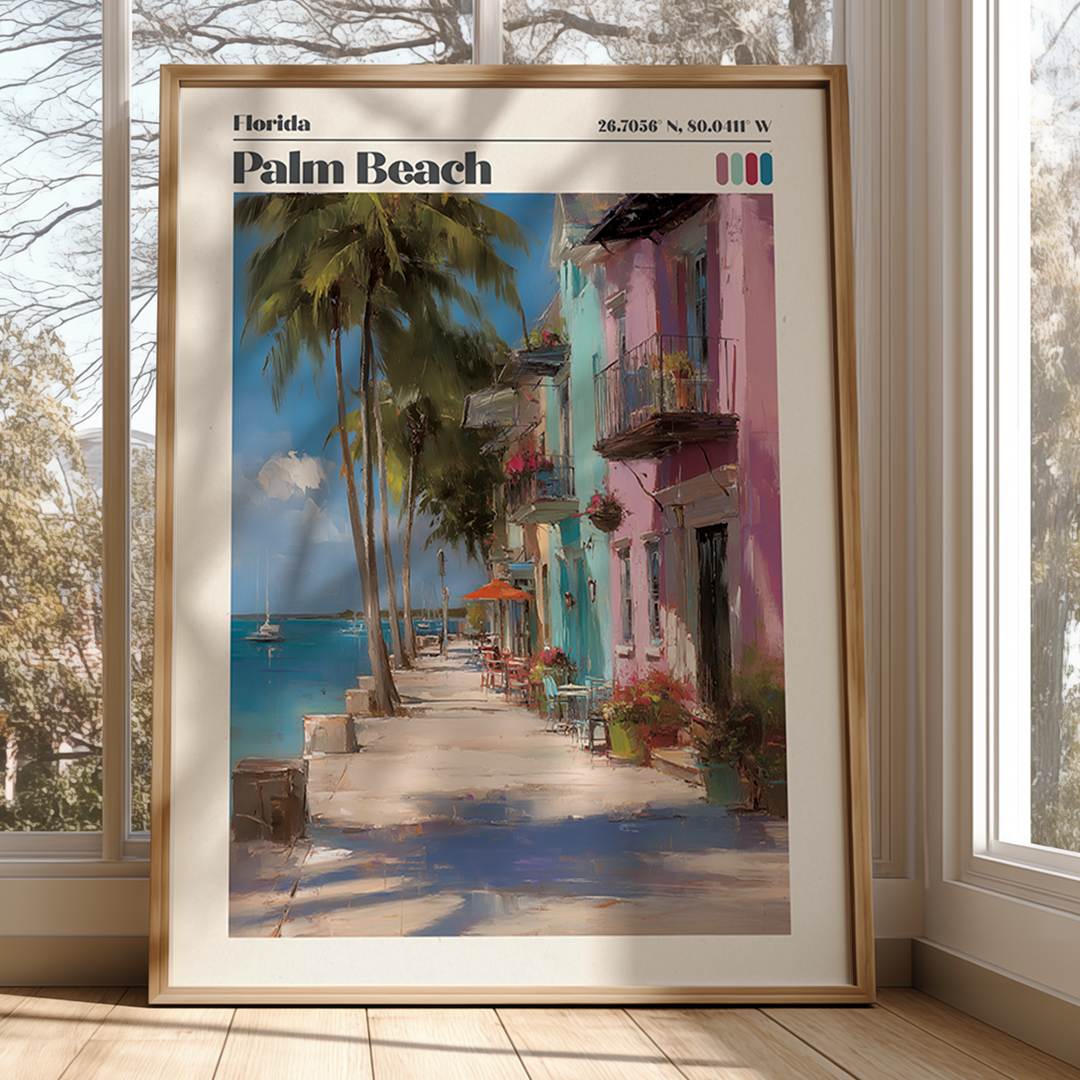 Framed artwork of a colorful street scene with palm trees and a waterfront view.