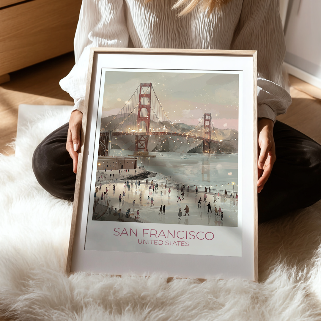 Person holding a framed picture of the Golden Gate Bridge in San Francisco.