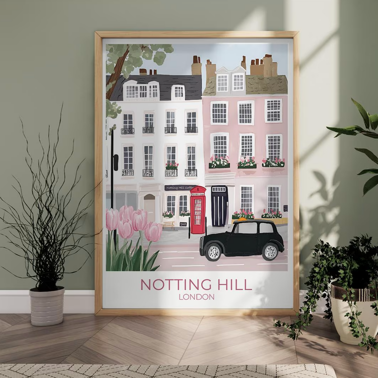 An illustration of a charming street in Notting Hill, London, featuring pastel-colored townhouses with flower boxes, a red British telephone booth, a black vintage car, and blooming pink tulips in the foreground. The text 'NOTTING HILL LONDON' appears at the bottom.