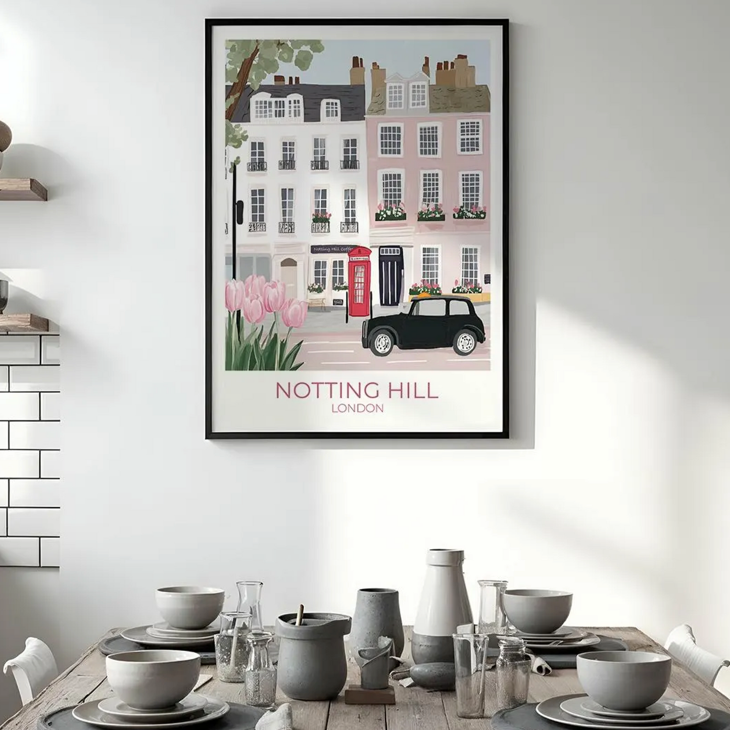 An illustration of a charming street in Notting Hill, London, featuring pastel-colored townhouses with flower boxes, a red British telephone booth, a black vintage car, and blooming pink tulips in the foreground. The text 'NOTTING HILL LONDON' appears at the bottom.