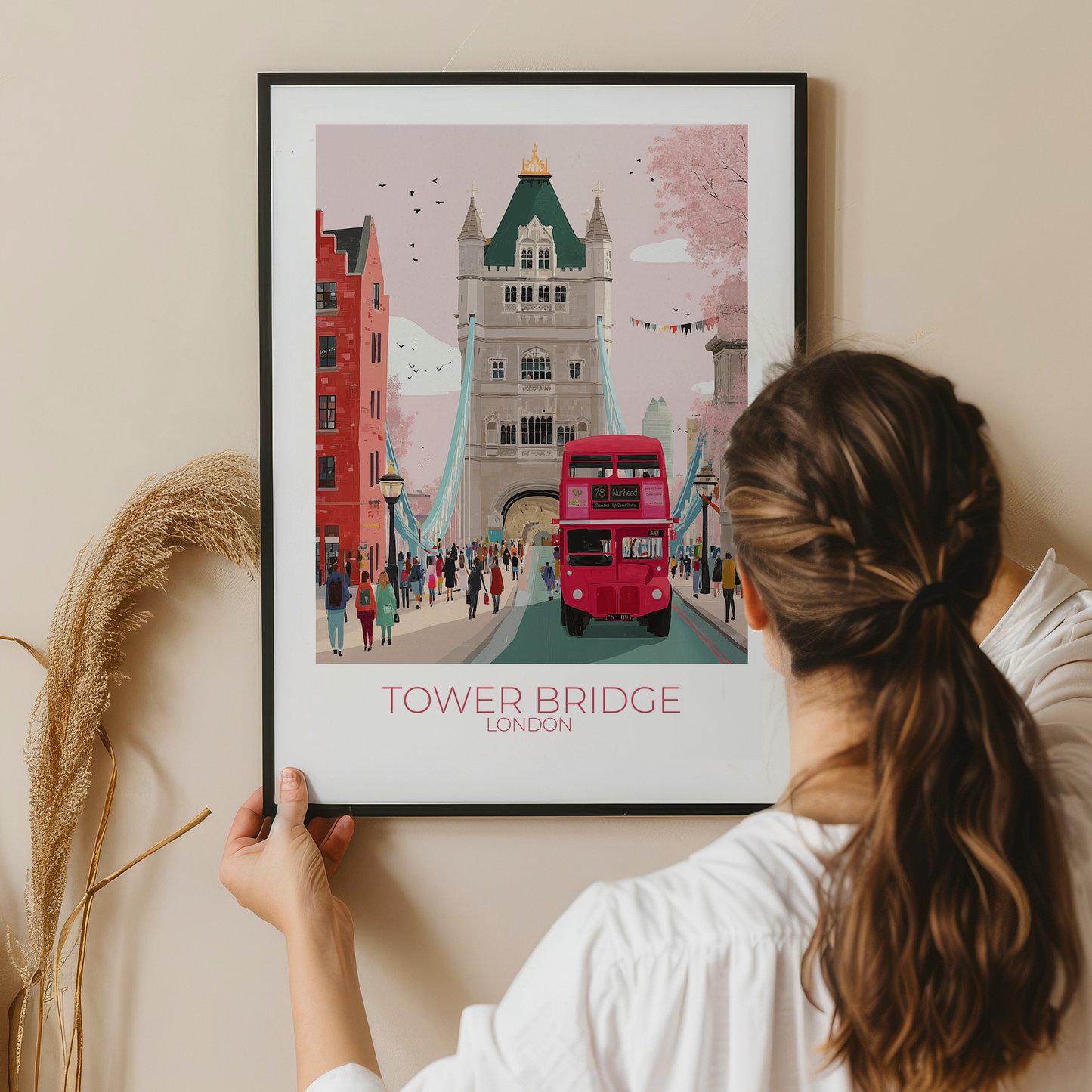 Person holding a framed print of Tower Bridge in London