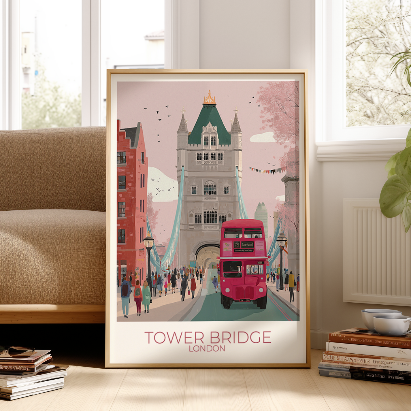 Framed artwork of Tower Bridge and a red double-decker bus in frame next to a sofa