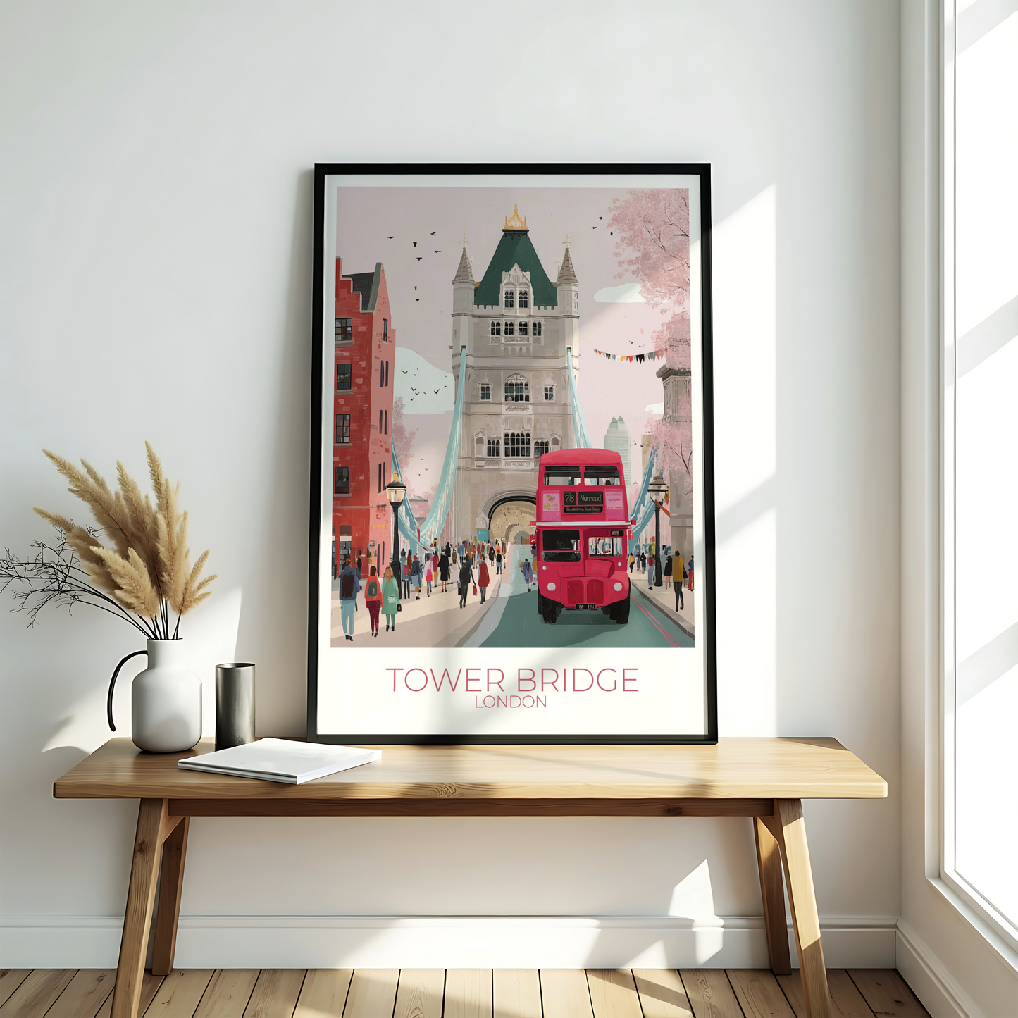 Framed artwork of Tower Bridge and a red double-decker bus in a frame on a coffee table