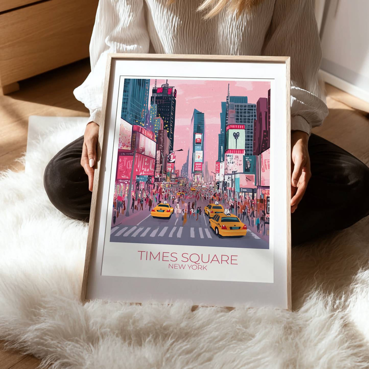 Person holding a framed print of Times Square, New York