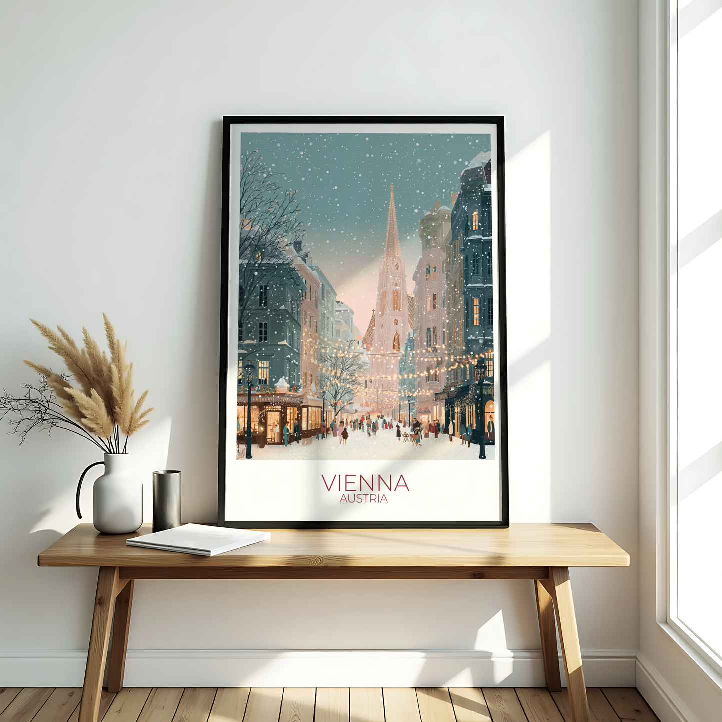 Framed artwork of a snowy cityscape with 'Vienna' text on a wooden bench.