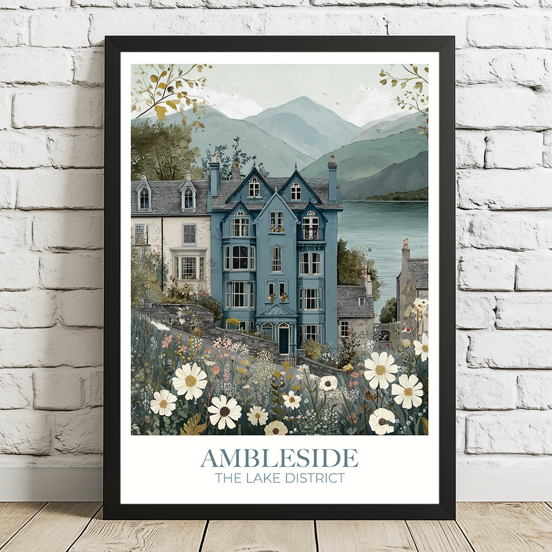Framed artwork of a scenic house with mountains and flowers, titled 'Ambleside The Lake District'.