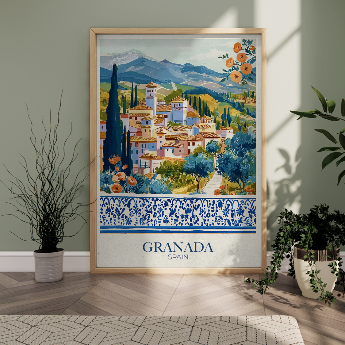 Framed artwork of Granada, Spain with decorative elements in a room setting.