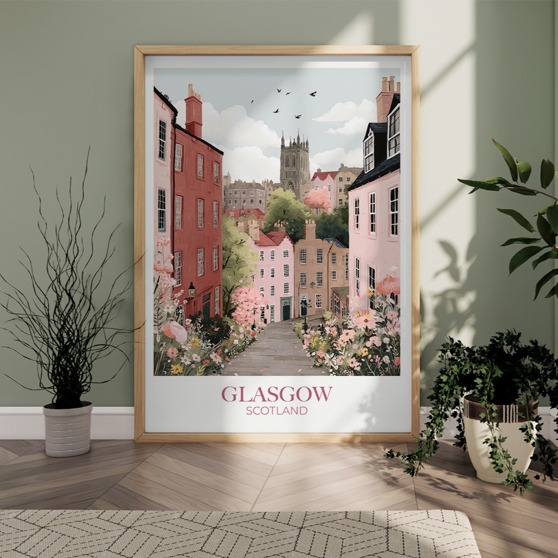 Framed artwork of Glasgow, Scotland on a wall with plants around