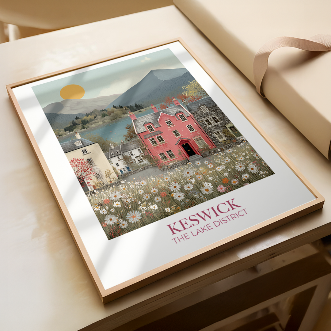 Framed artwork of Keswick, The Lake District on a wooden surface