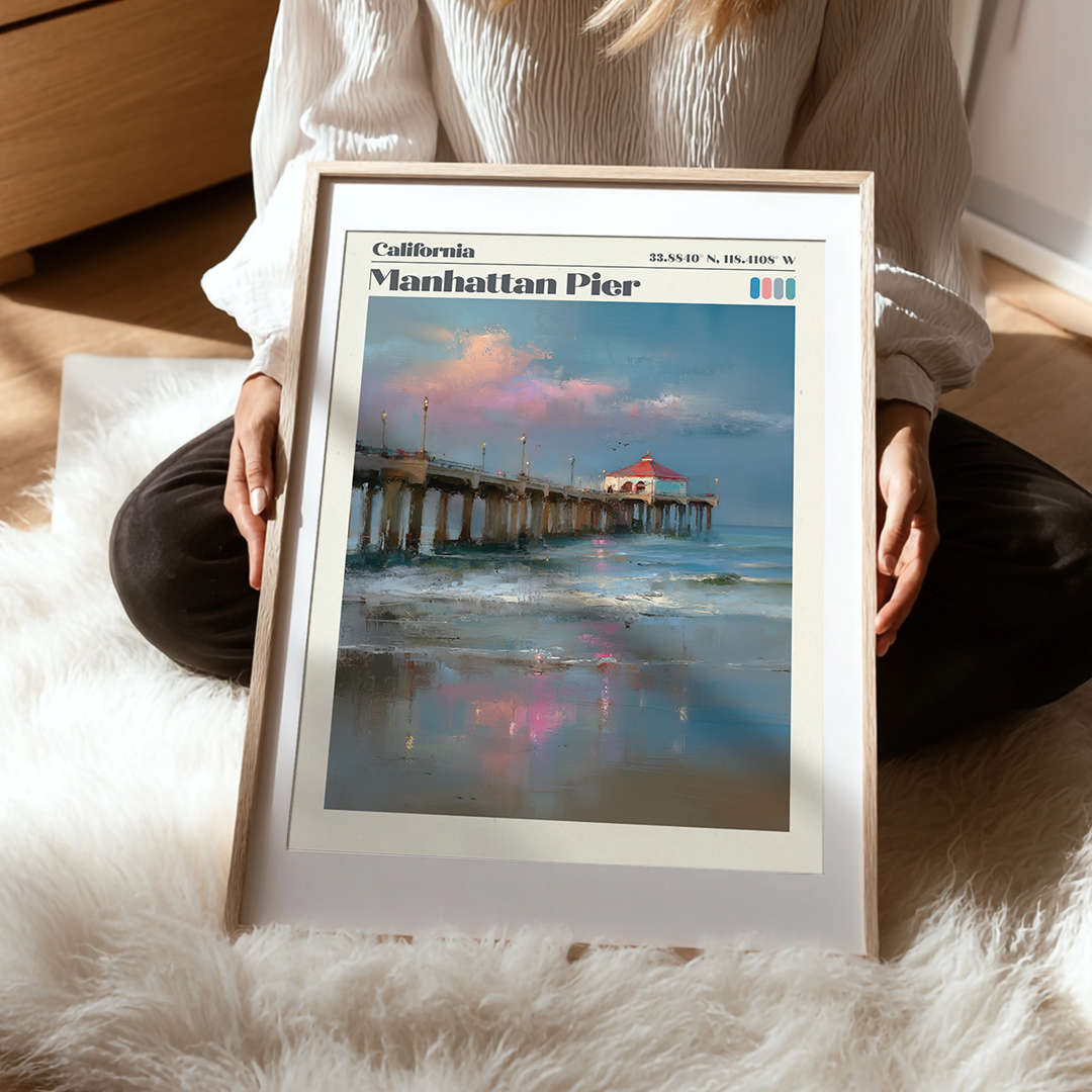 Person holding a framed picture of Manhattan Pier in California