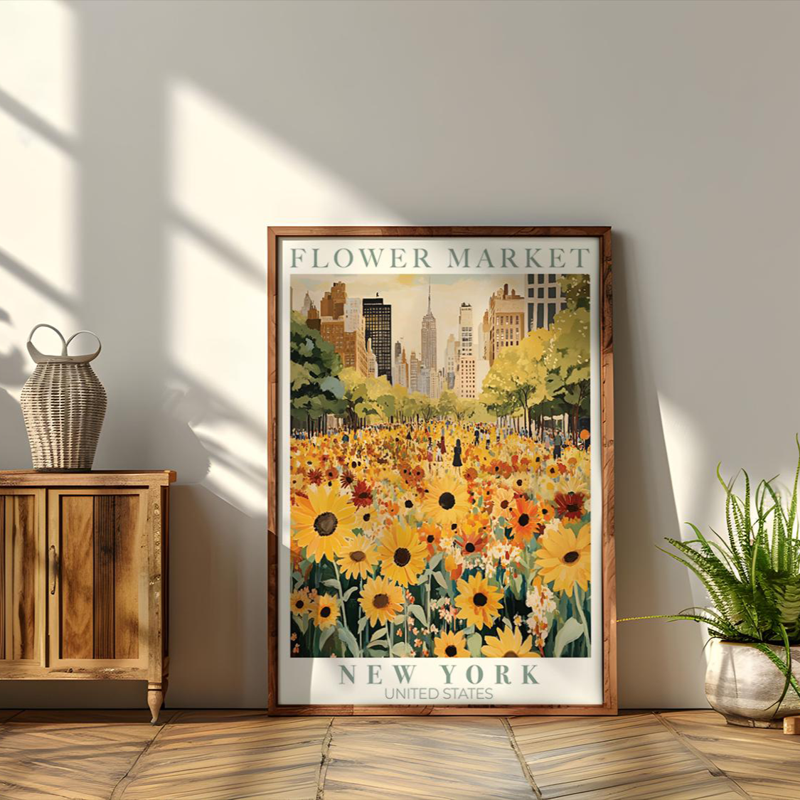 Framed poster of a flower market in New York on a wall next to a wooden cabinet with plants.