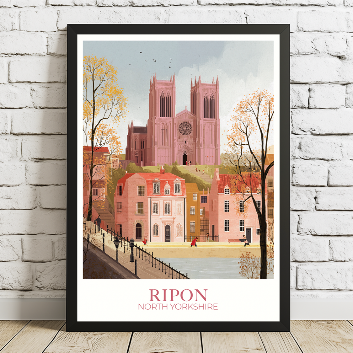 Framed artwork of Ripon, North Yorkshire on a white brick wall.