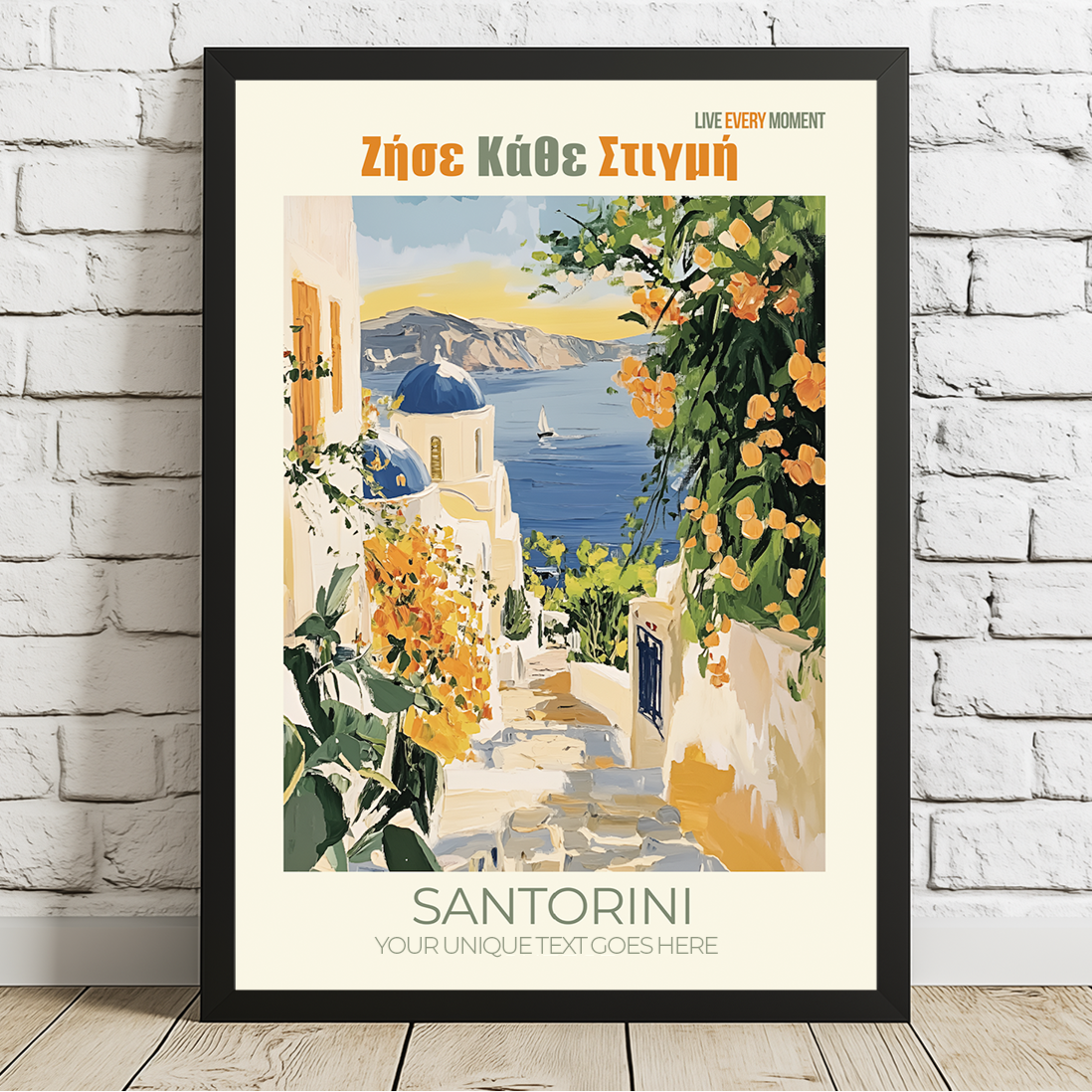 Framed artwork of Santorini with a scenic view on a white brick wall.
