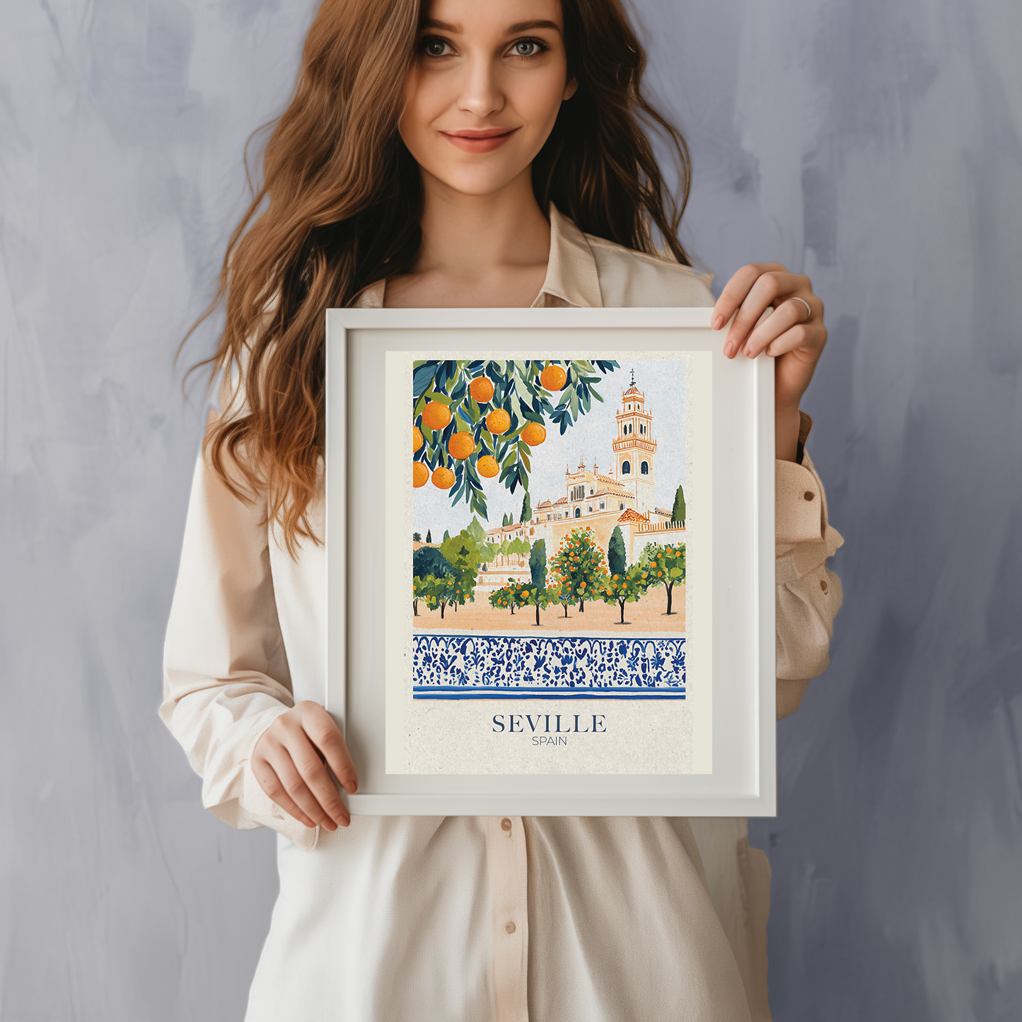 Framed artwork of Seville, Spain with oranges and a building on a wall with plants around.