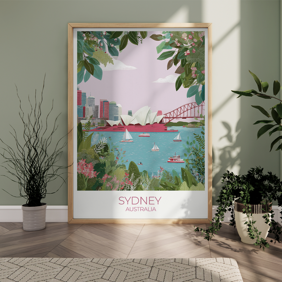 Framed poster of Sydney, Australia with a cityscape and bridge, placed on a wooden floor with plants around.