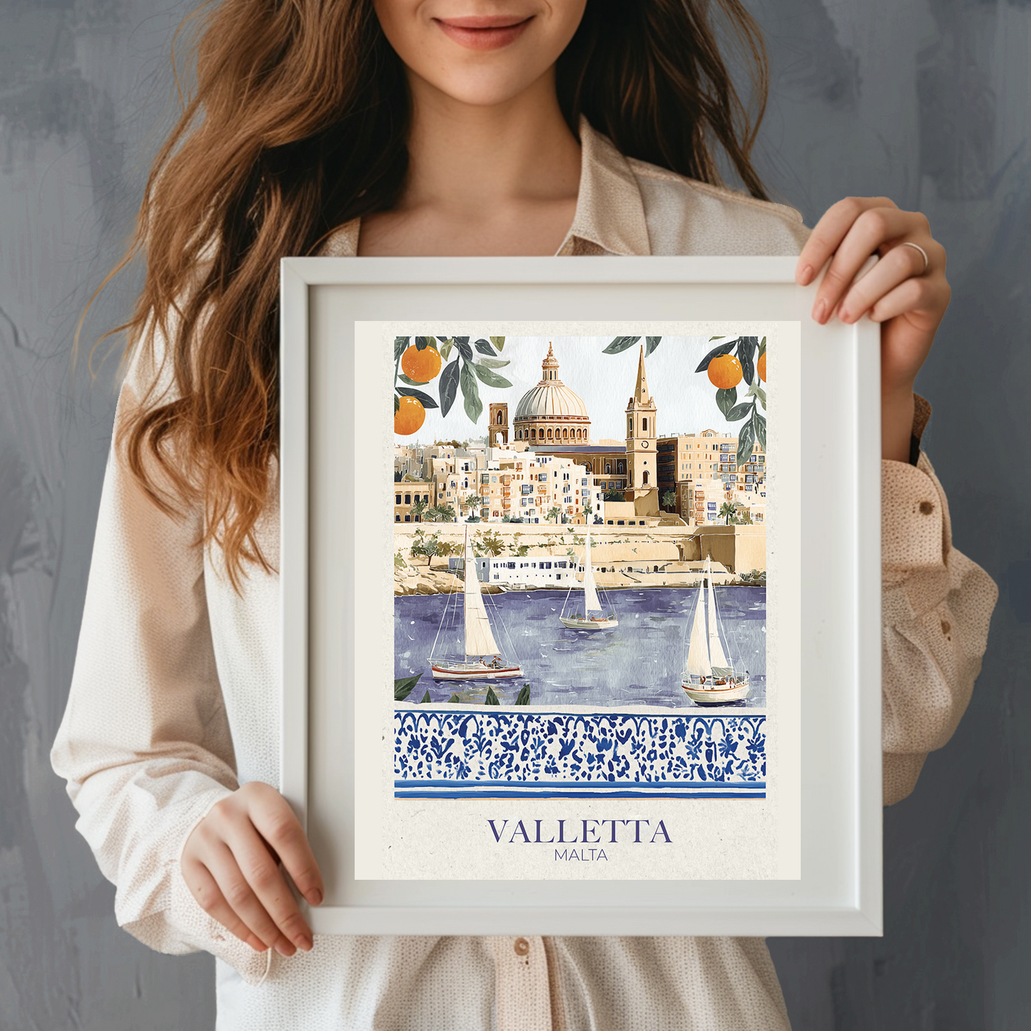 Person holding a framed artwork of Valletta, Malta