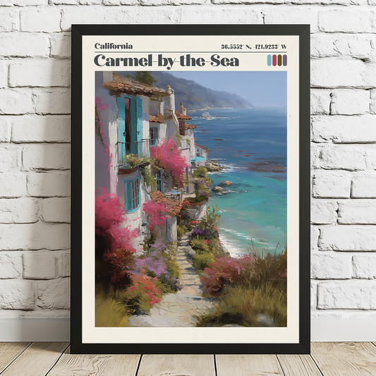 Framed artwork of a coastal scene with buildings and flowers, titled 'Carmel by the Sea', on a white brick wall.