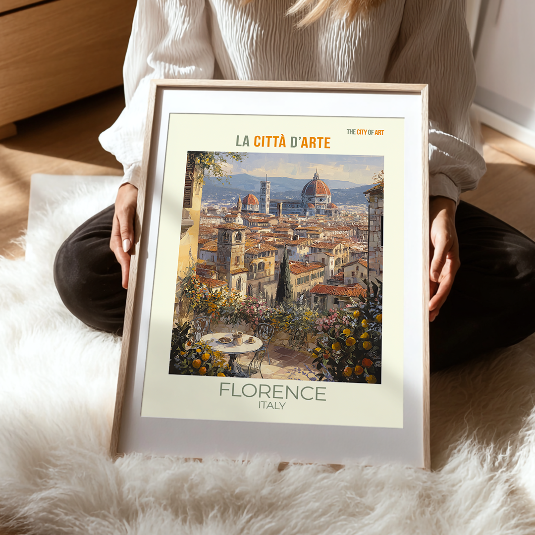 Person holding a framed print of Florence, Italy with a scenic view.