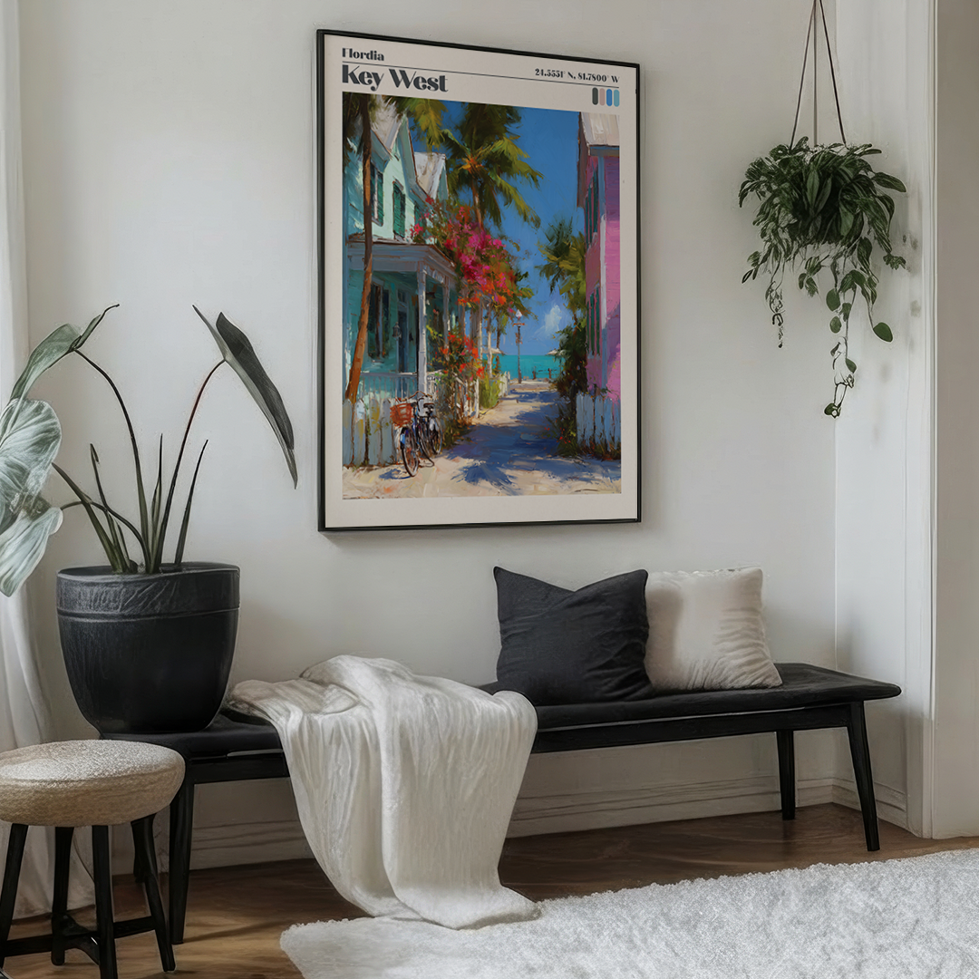 Living room with a bench, cushions, and a large framed painting of Key West on the wall.