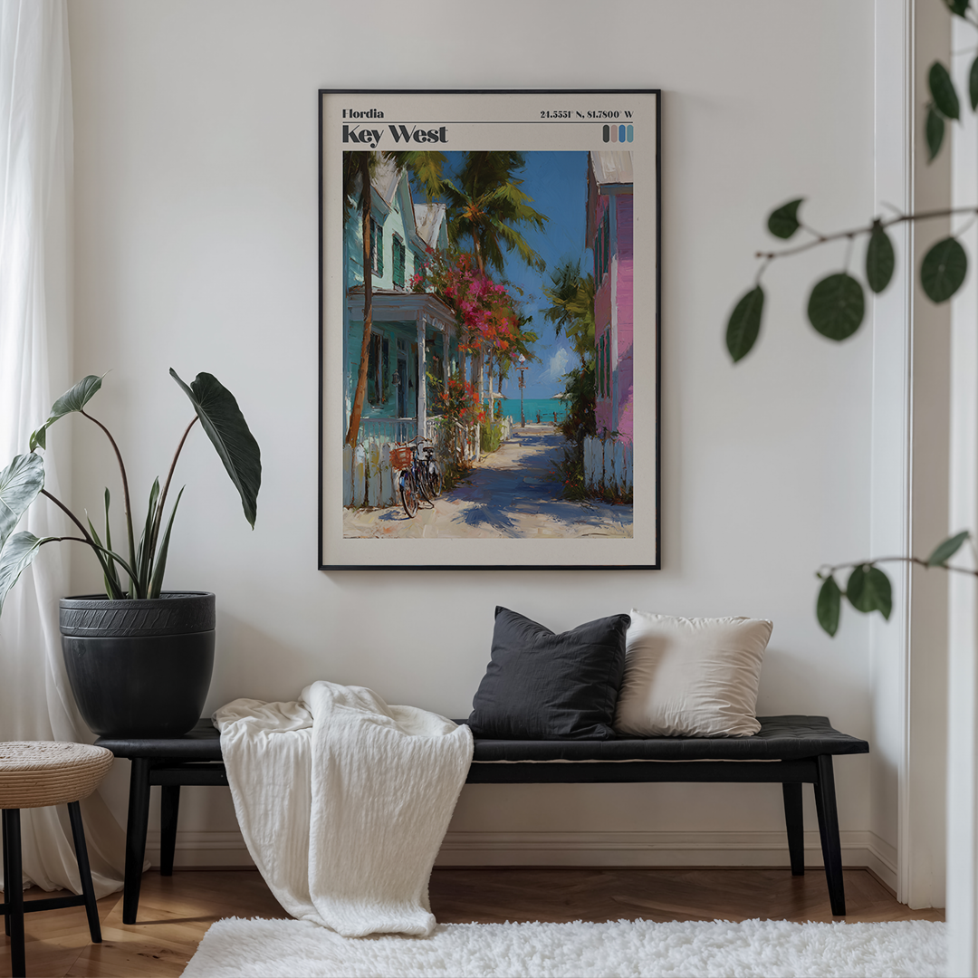 Living room with a bench, plant, and framed artwork of Key West.