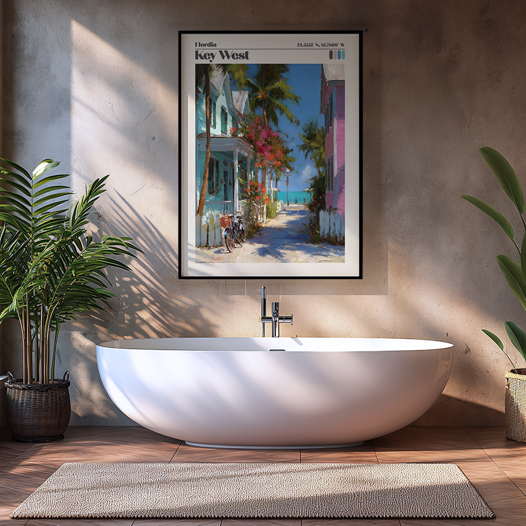 Modern bathroom with a freestanding bathtub, framed artwork of a beach scene, and plants.