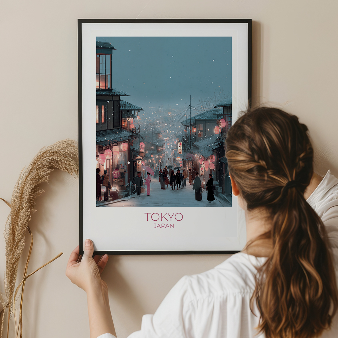 Person holding a framed print of a Tokyo street scene
