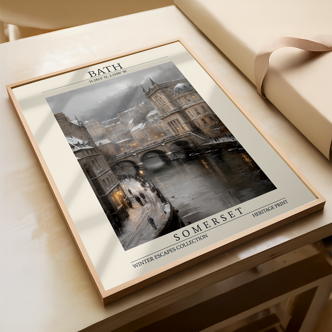 Framed print of a snowy scene with text on a wooden surface