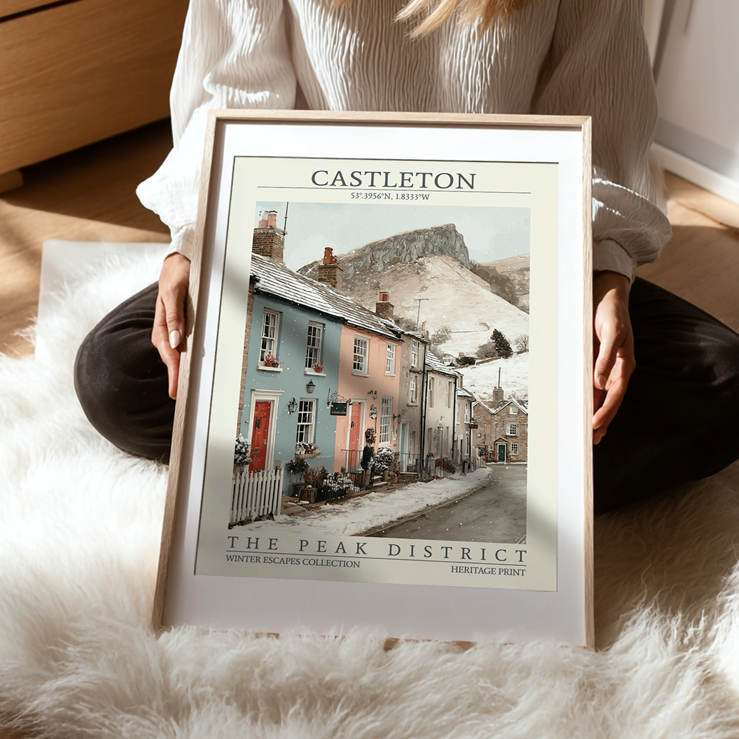 Person holding a framed print of Castleton in The Peak District
