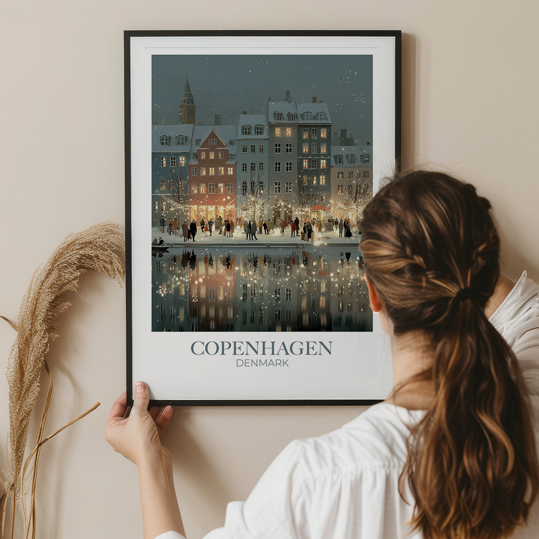 Woman holding a framed print of Copenhagen, Denmark