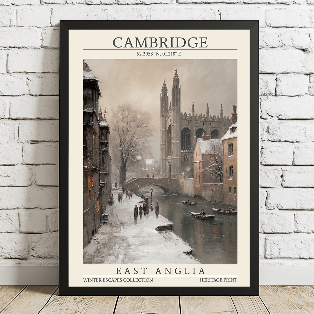 Framed print of a snowy scene in Cambridge with a river and historic buildings.