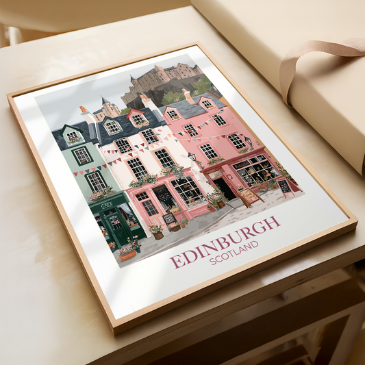 Framed artwork of Edinburgh, Scotland with colorful buildings on a table.