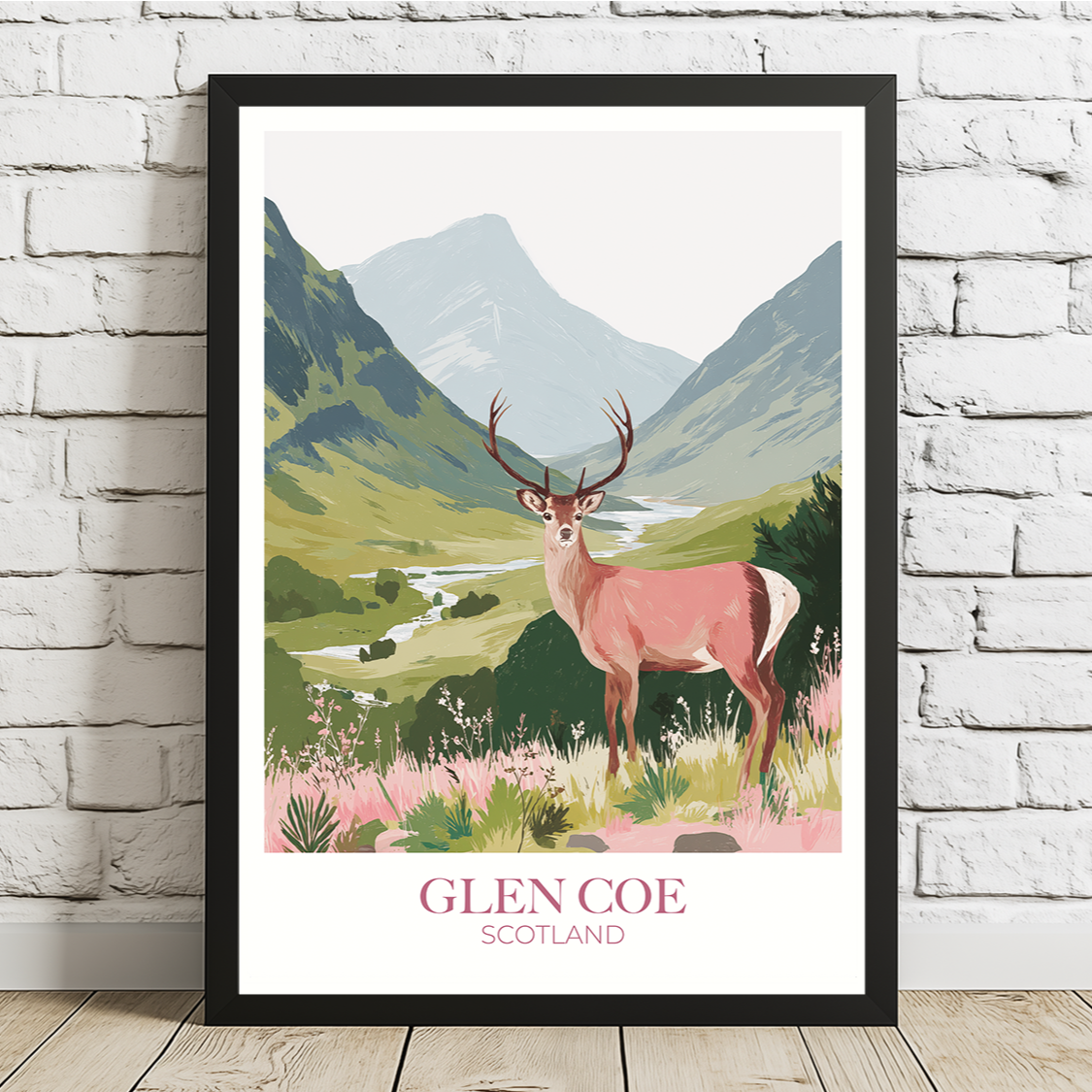 Framed artwork of a deer in a mountainous landscape with 'Glen Coe Scotland' text on a white brick wall.