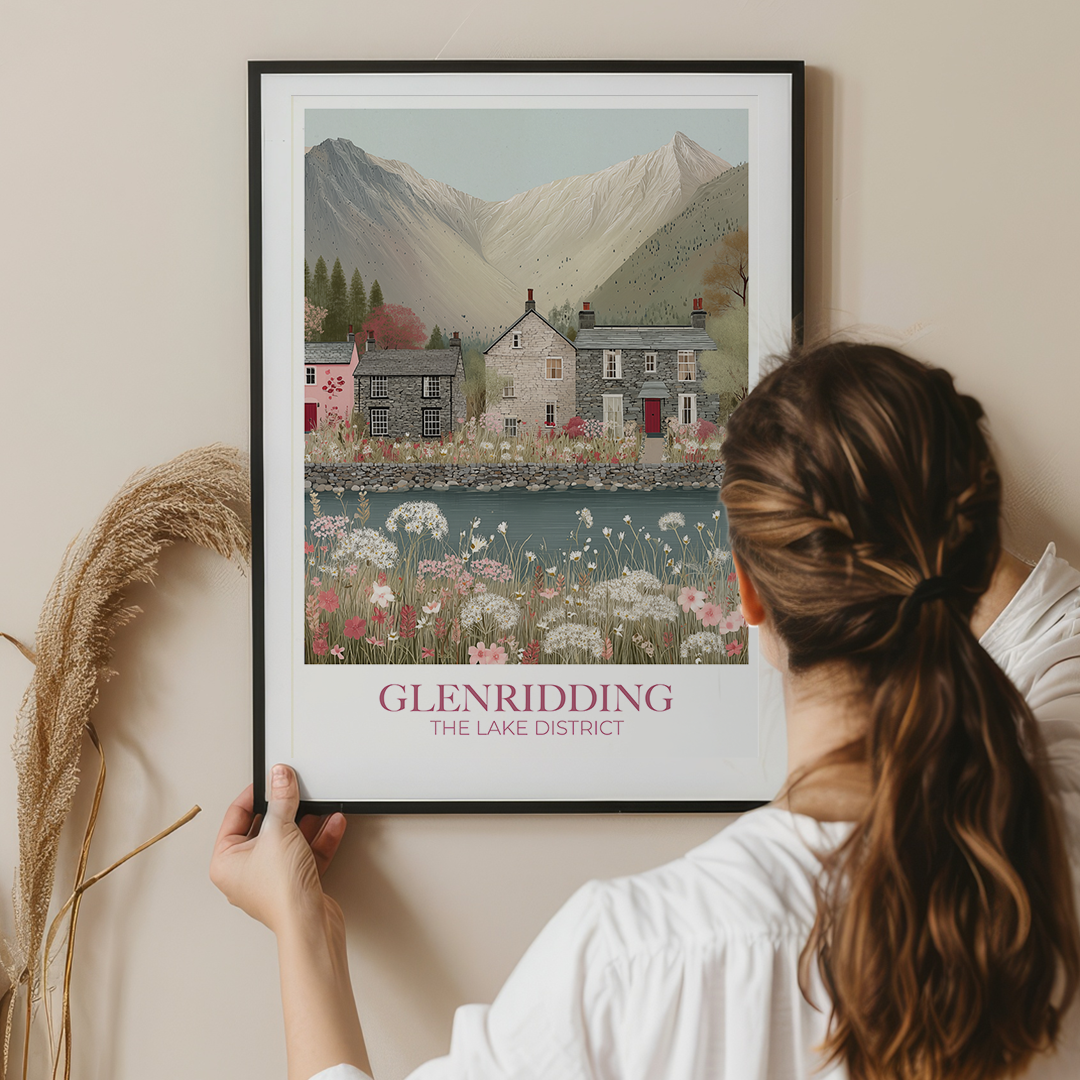 Person holding a framed print of Glenridding in The Lake District against a beige wall.
