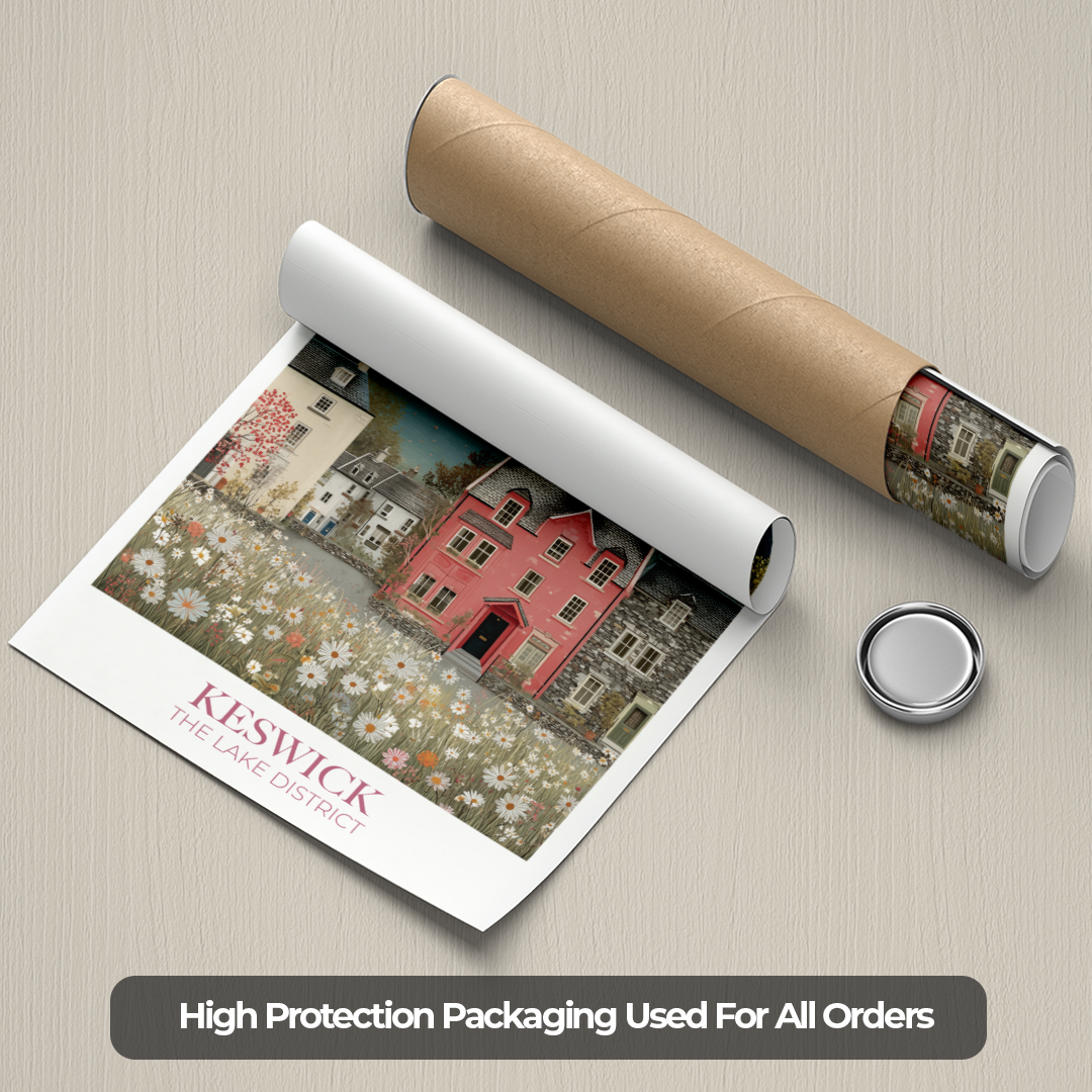 Roll of paper with a printed design of a village scene, next to a cardboard tube and a small round object on a beige surface.