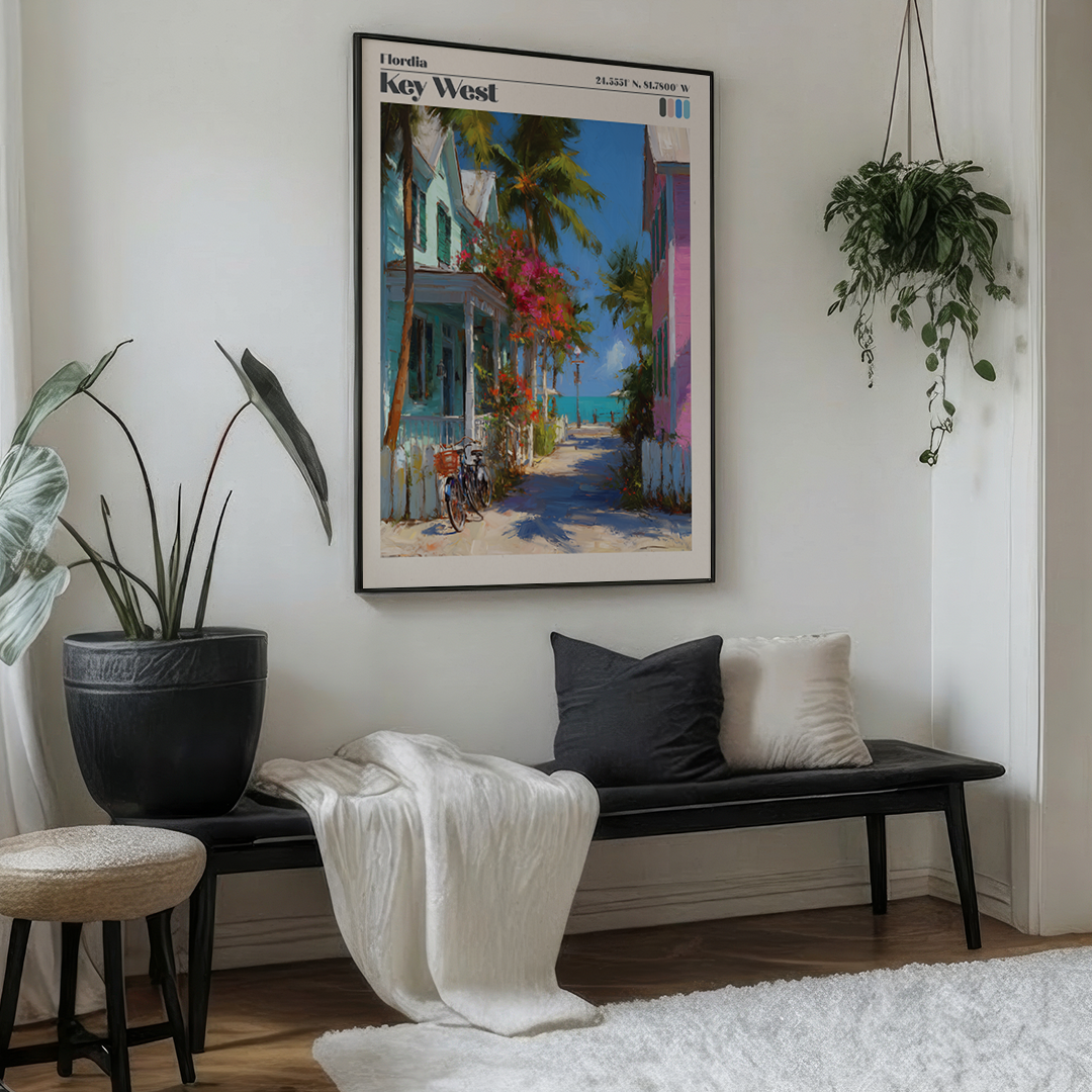 Living room with a bench, cushions, and a framed painting of Key West on the wall.