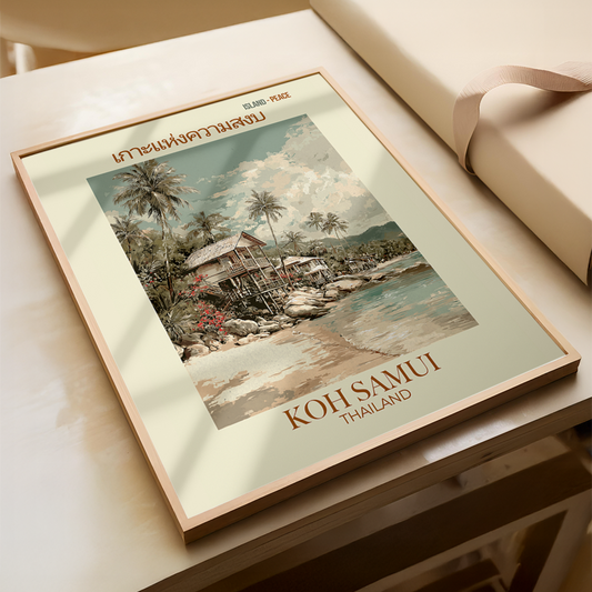 Framed artwork of a tropical scene with 'Koh Samui, Thailand' text on a wooden surface.