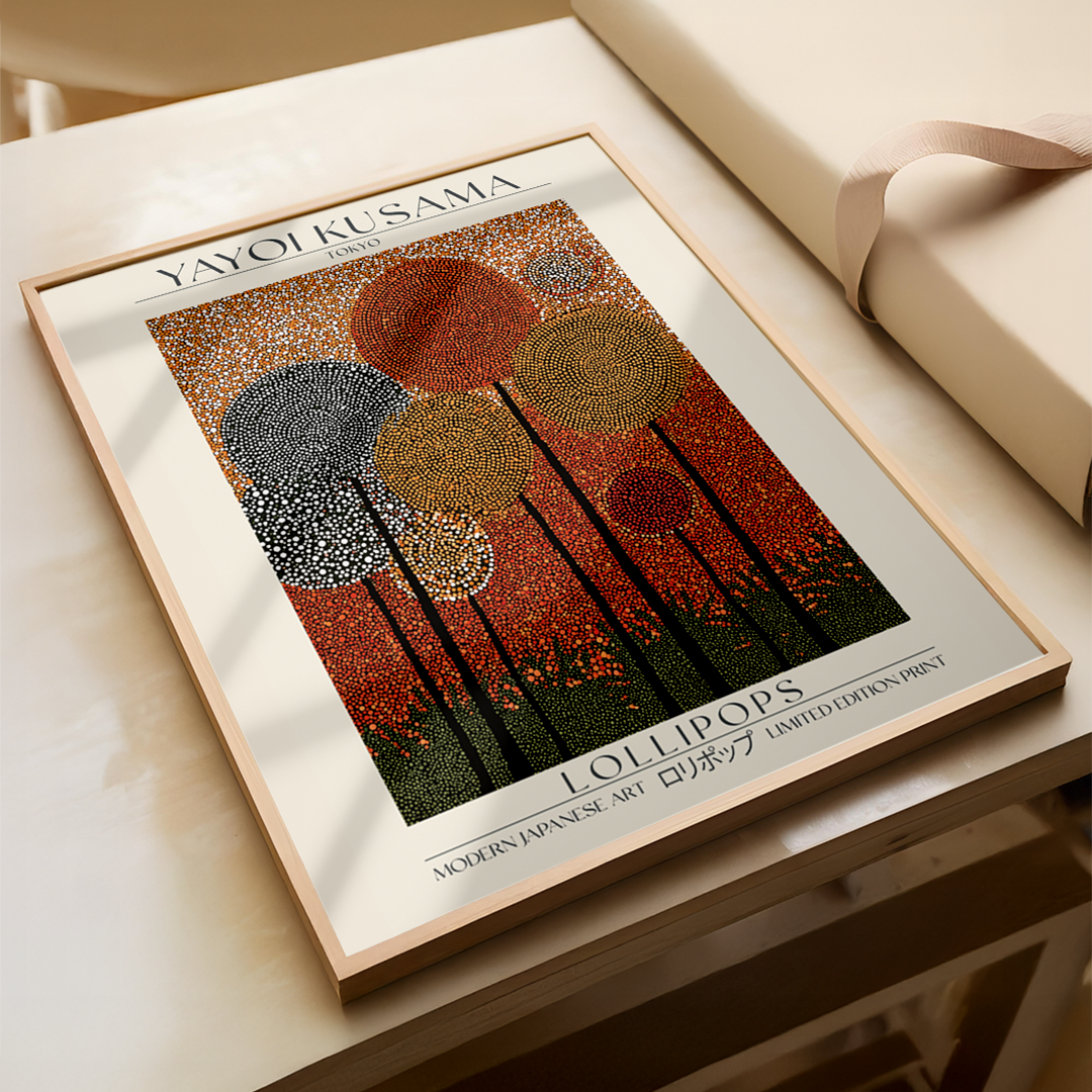 Framed artwork of lollipops by Yayoi Kusama on a light surface