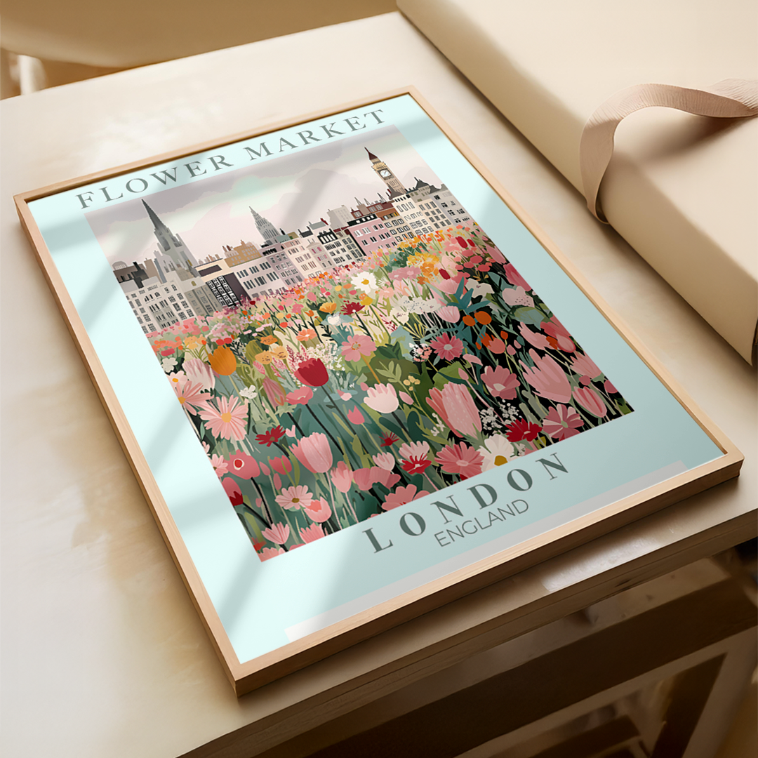 Framed artwork of a floral market in London on a table.