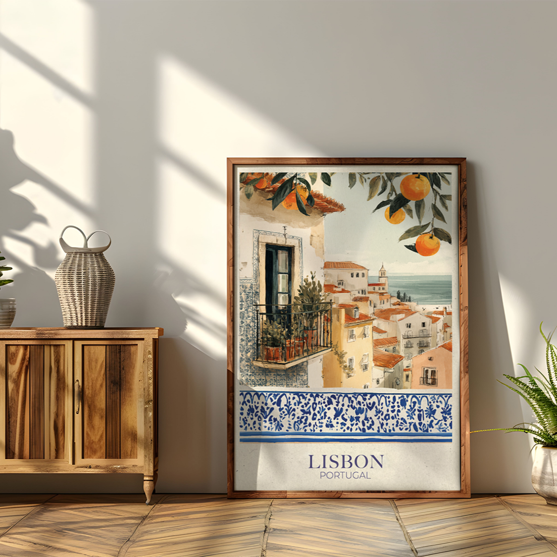 Framed artwork of Lisbon on a wall with wooden cabinet and plants