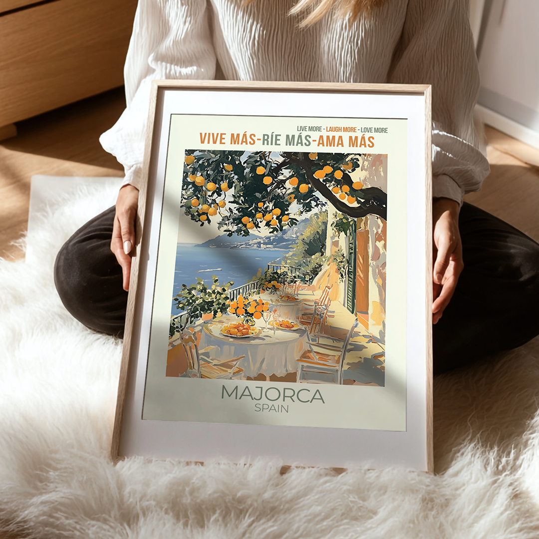 Person holding a framed poster of Majorca, Spain with a scenic view.