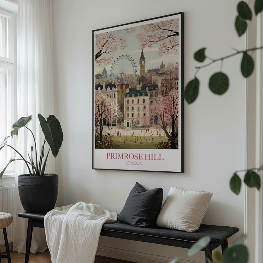 Living room with a framed print of Primrose Hill, London on the wall above a bench.