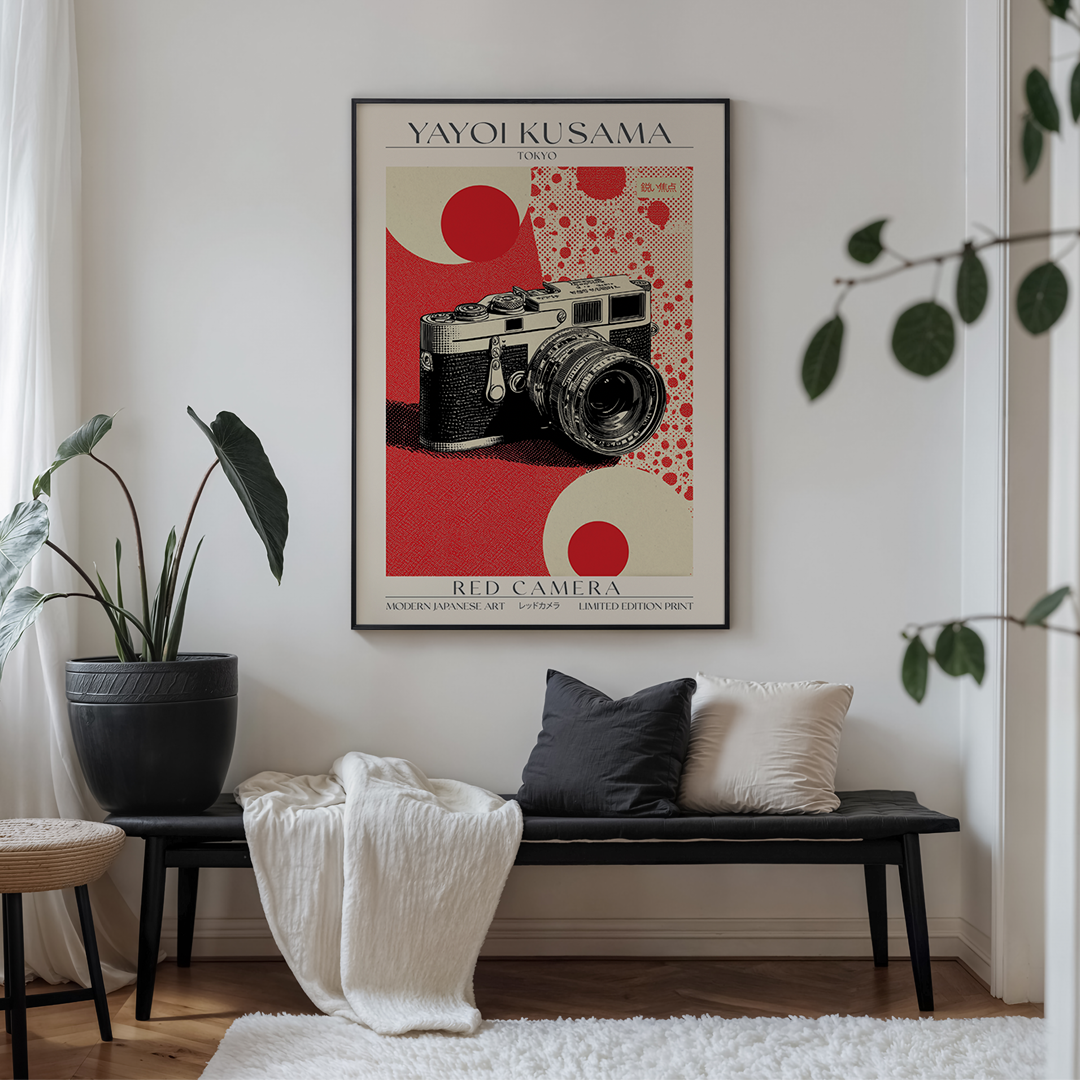 Poster of a camera by Yayoi Kusama in a living room setting with a bench and plant.