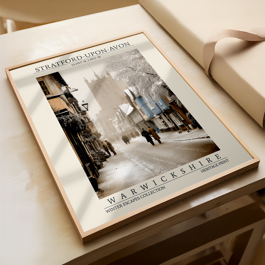 Framed print of a snowy street scene with text on a wooden surface