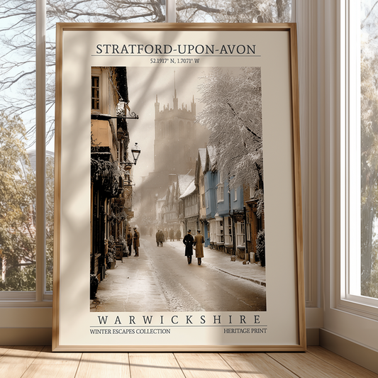 Framed print of a snowy street scene in Stratford-upon-Avon, Warwickshire, with a wooden frame.