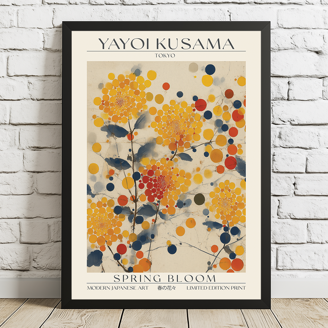 Framed Yayoi Kusama 'Spring Bloom' artwork on a white brick wall.